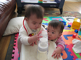 reaching for bottles at nine months