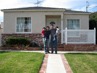 the family in front of the house