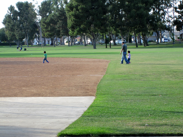 At the Park with Their Grandfather