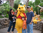 Suephy, Ed, and kids with Winnie the Pooh