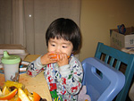 Miranda Eating an Orange