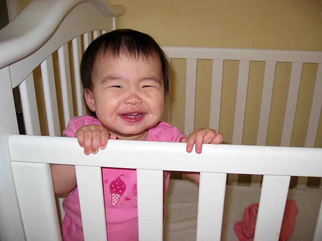 Eleanor Smiling in Her Crib