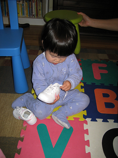 Miranda Examining Her Shoes