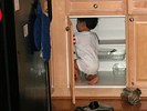 jared exploring the cupboards