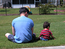 sitting on the grass